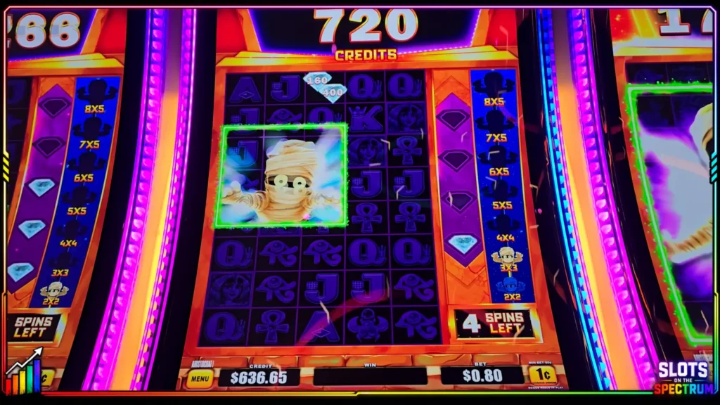 Mo’ Mo’ Mo’ Mummy bonus screen showing Mo’ Reels and Mo’ Symbols with two diamond values in one expanded position.