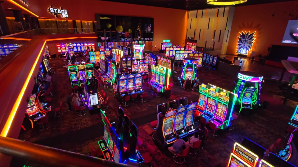 Wide view of the slot floor and Stage 954 at The Casino @ Dania Beach.