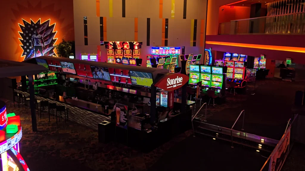 Sunrise Bar and nearby slot machines on the gaming floor at The Casino @ Dania Beach.