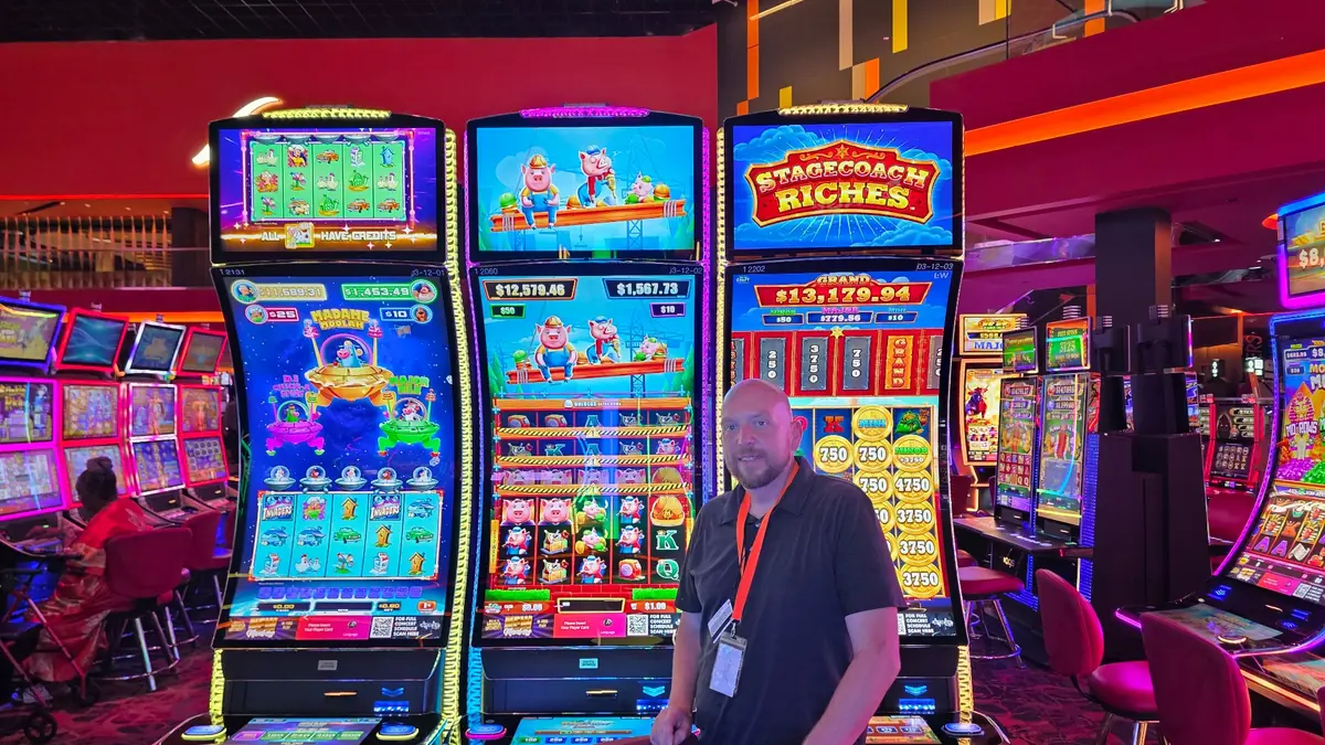 Wojtek in front of the center Huff N’ Puff - High Rise cabinet at The Casino @ Dania Beach.