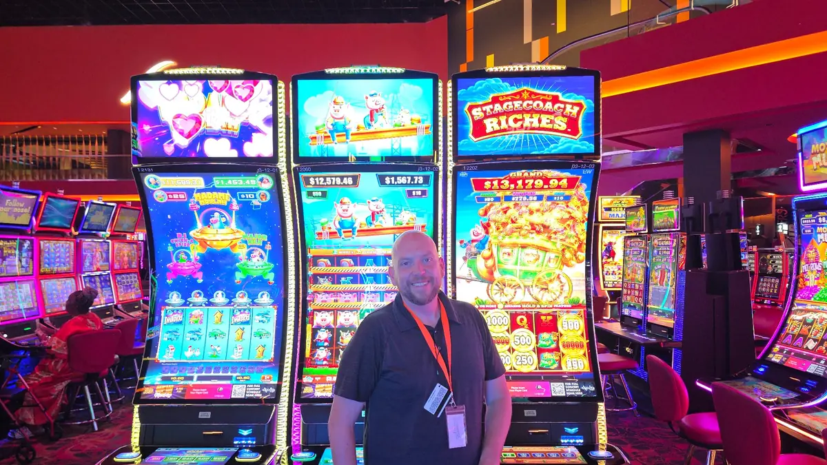 Wojtek beside the Stagecoach Riches cabinet on the right at The Casino @ Dania Beach.